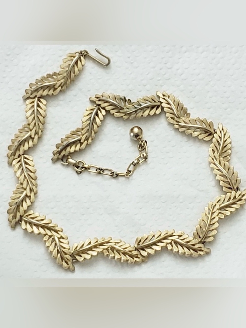 Vintage Crown Trifari silver-toned leaf link choker necklace.